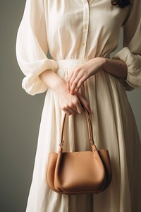 Woman hand holding bag handbag purse accessories. 