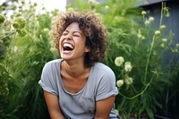 Middle age woman laughing outdoors adult contemplation. 