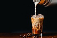 Iced coffee pouring drink milk. 