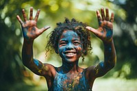 African american girl outdoors child paint. 