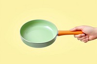 Hand hold pan throwing cookware. 