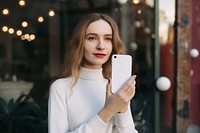 White smartphone selfie adult woman. AI generated Image by rawpixel.