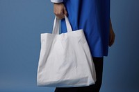 A white bag handbag person adult. 