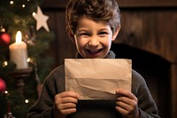 Letter packaging christmas holding child. 