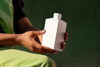 Carton juice box bottle adult hand. 