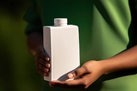 Carton juice box bottle hand midsection. AI generated Image by rawpixel.