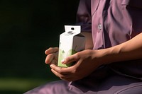 Carton juice box hand perfume photo. AI generated Image by rawpixel.