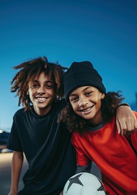 Two diversity cool kids playing sport football sports togetherness. 