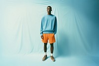 Men fashion sweatshirt standing shorts. AI generated Image by rawpixel.
