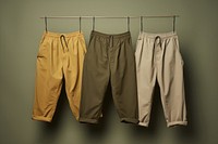 Pants clothing khaki clothesline. AI generated Image by rawpixel.