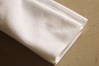 White terry towel textile folded linen.