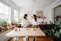 2 women architecture furniture kitchen. 