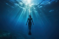 Woman freediving underwater adventure swimming. 