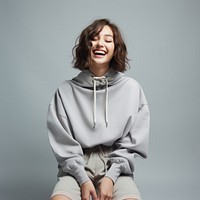 Sweatshirt laughing sweater sitting. AI generated Image by rawpixel.