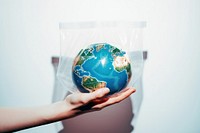 Holding planet globe earth. AI generated Image by rawpixel.