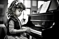 Little spanish girl playing piano keyboard musician pianist. AI generated Image by rawpixel.