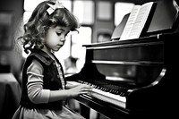 Little spanish girl playing piano keyboard musician pianist. 