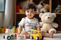 Cute toddler playing with toys