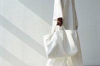 White bag handbag purse accessories. 