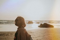 Woman at beach, light leak effect