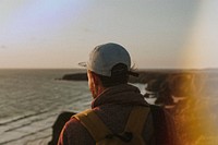 Man at beach, light leak effect