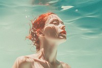 Woman underwater with film grain effect