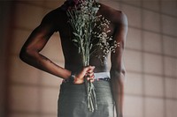 Man holding flower bouquet rear view, window shadow