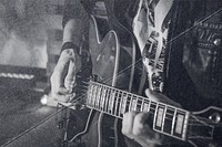 Man playing guitar, fold paper texture