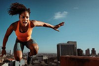 African woman jumping architecture determination exercising. 