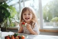 Strawberry eating child happy. 