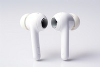 A White headphones wireless earpieces white white background electronics. 