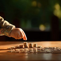 Hand picking up coins. 