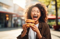 Eating outdoors burger happy. 