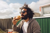 Eating outdoors glasses burger. AI generated Image by rawpixel.