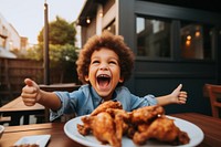 Eating outdoors happy fried chicken. 