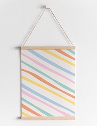 Hanging poster mockup psd on white wall with pastel stripes pattern