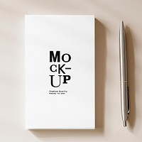 Pen and white notebook mockup