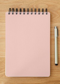 Blank plain pink notebook page with a pen mockup