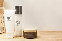 Skincare bottle mockup psd on bathroom shelf