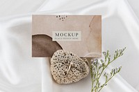 Card mockup on a porous rock aerial view