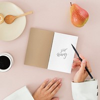 Woman writing a diary mockup