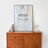 Picture frame mockup on a wooden cabinet