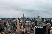 Dusk view of Manhattan's skyline. Many skyscrapers, including the Empire State Building, can be seen from this elevated perspective.