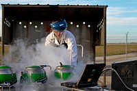 U.S. Air Force Airman 1st Class Christopher Garrison, an F-16C Fighting Falcon aircraft crew chief assigned to the 177th Aircraft Maintenance Squadron, New Jersey Air National Guard, performs liquid oxygen servicing at Atlantic City Air National Guard Base, N.J., Nov. 6, 2013.