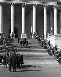 John F. Kennedy Lying in State November 25, 1963Jacqueline Kennedy and her brothers-in-law, Attorney General Robert Kennedy and Massachusetts Democratic Senator Ted Kennedy leave the Capitol Rotunda. Photo by Architect of the Capitol photographers. Original public domain image from Flickr