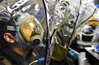 U.S. Navy Lt. j.g. Siyan Li, assigned to the guided missile cruiser USS Antietam (CG 54), is fitted for an MCU2-P gas mask as part of the Naval Safety Advisory Council’s chemical, biological and radiological defense readiness improvement program in Yokosuka, Japan, Feb. 25, 2015.