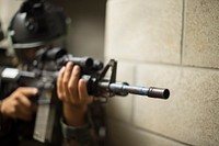 A Peruvian special operations sailor maintains security in a hallway during a nighttime direct action raid scenario as part of exercise Rim of the Pacific (RIMPAC) 2014 at the Kahuku Training Area, Hawaii, July 13, 2014.