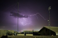 A dust storm carrying small amounts of rain sparks lightning across the sky over camps Leatherneck and Bastion in Helmand province, Afghanistan, May 3, 2014.