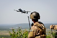 U.S. Air Force Airman 1st Class Nelson A. Walker, assigned to the 9th Air Support Operations Squadron, observes an A-10 Thunderbolt II aircraft May 22, 2014, at the Joint Multinational Readiness Center in Hohenfels, Germany, during a live-fire operation as part of Combined Resolve II. Combined Resolve II is a U.S.-led combined arms exercise designed to prepare U.S. and European forces for multinational operations.