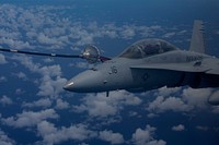 A U.S. Marine Corps F/A-18D Hornet aircraft assigned to Marine All Weather Fighter Attack Squadron (VMFA(AW)) 533, Marine Aircraft Group 31, 2nd Marine Aircraft Wing refuels in the air over Guam Sept. 17, 2014, during exercise Valiant Shield 2014.